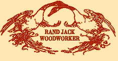 drawing of logo of two swans in natural unpainted wood with necks intertwined, titled Rand Jack, Woodworker